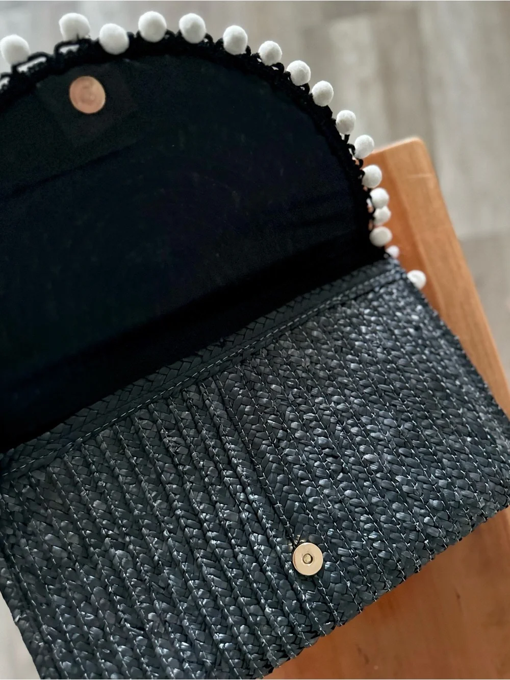 Shiraleah Navy Woven Straw Clutch with White Pom-Pom Trim